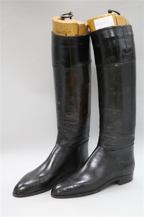 A pair of black ladies riding boots